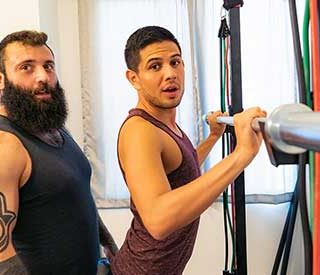 Mischievous trainer, Markus Kage, is at it again! When a new client, Alex Montenegro, and he meet for their first session, the hairy, muscled tattooed trainer is told that he wants to work on his butt.