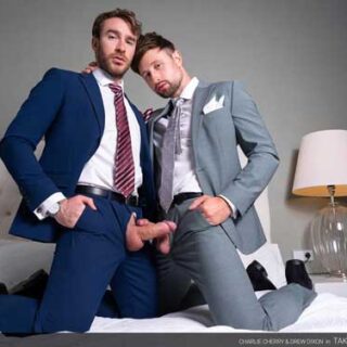 Sitting on the corner of the bed, fully suited, horned up Charlie Cherry is jerking off his monster cock through the fly of his pants. He wipes the precum off his cock with his striped tie and keeps jerking ever so gently.